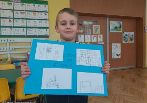 Miłosz Góźdź z pracą konkursową.